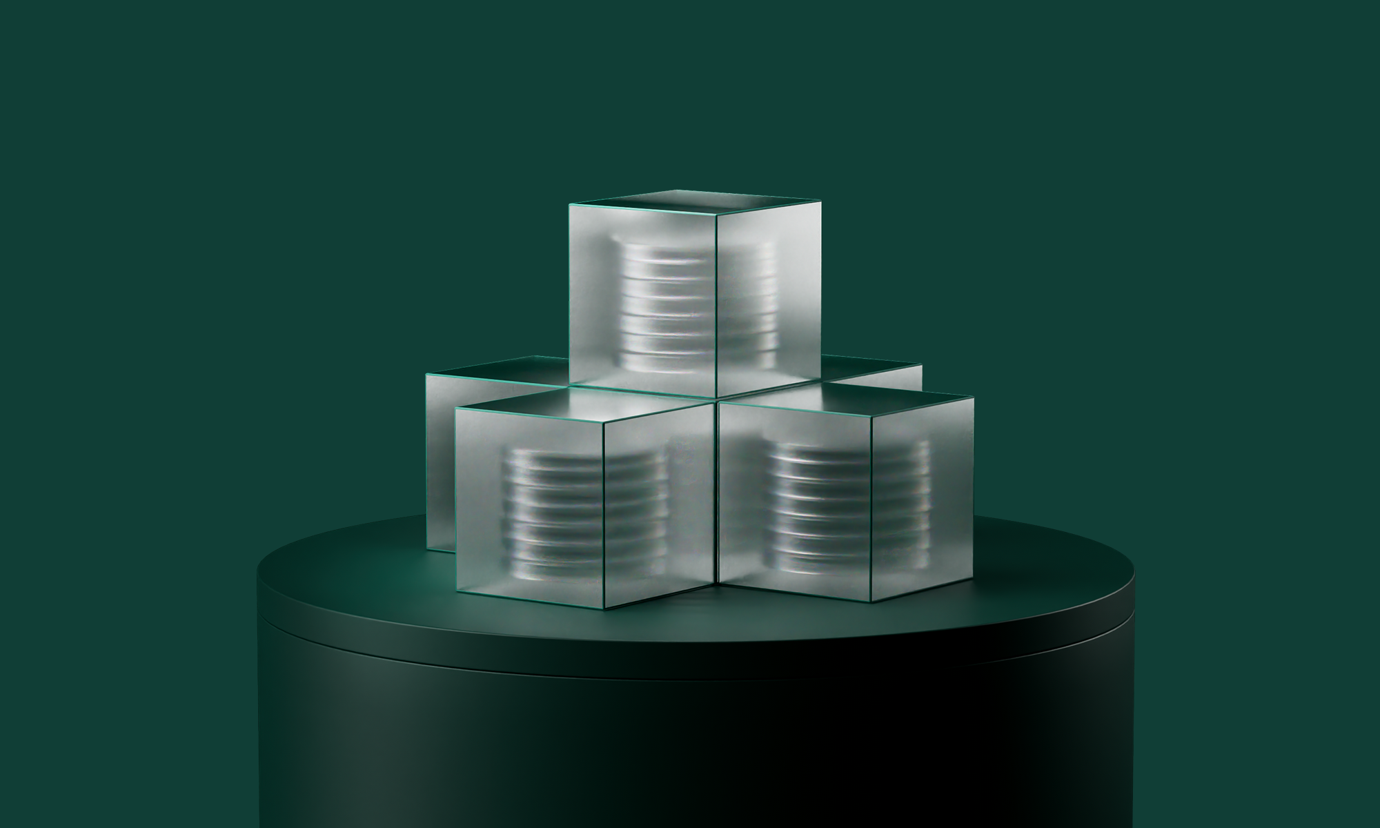 Four frosted glass cubes with visible coils inside, stacked on a dark cylindrical pedestal against a deep green background.