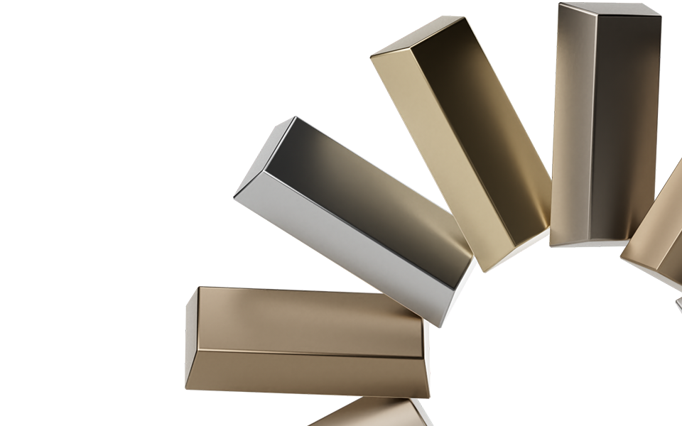 Several metallic rectangular boxes in gold and silver shades are arranged in a dynamic, tilted formation against a neutral background.